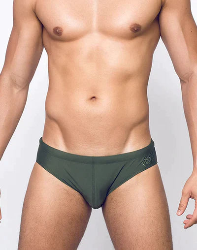 Dark green swim trunks with a subtle logo on the side designed for sensuality by 2eros