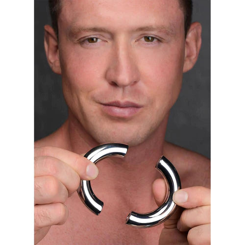 Shiny chrome-plated stainless steel magnetic cock ring with smooth curved design for enhanced pleasure