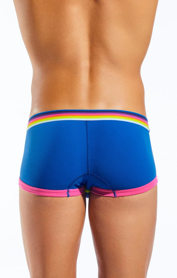 Bright blue cx68n swim trunks with rainbow-striped waistband and pink trim blending retro design with modern style