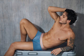 Blue mesh briefs with a pink waistband showcasing the latest trends in breathable underwear for 2026