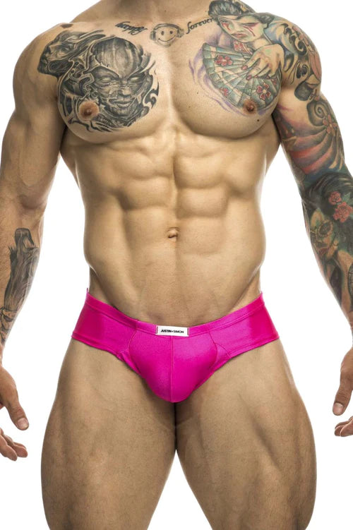 Vibrant pink justin simon xsj22 cheek briefs with sleek form-fitting design and white brand tag at waistband