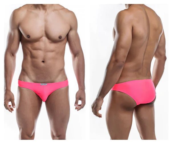 Bright pink form-fitting swim trunks with a sleek modern design featured in the ultimate guide to men’s bikini swimwear