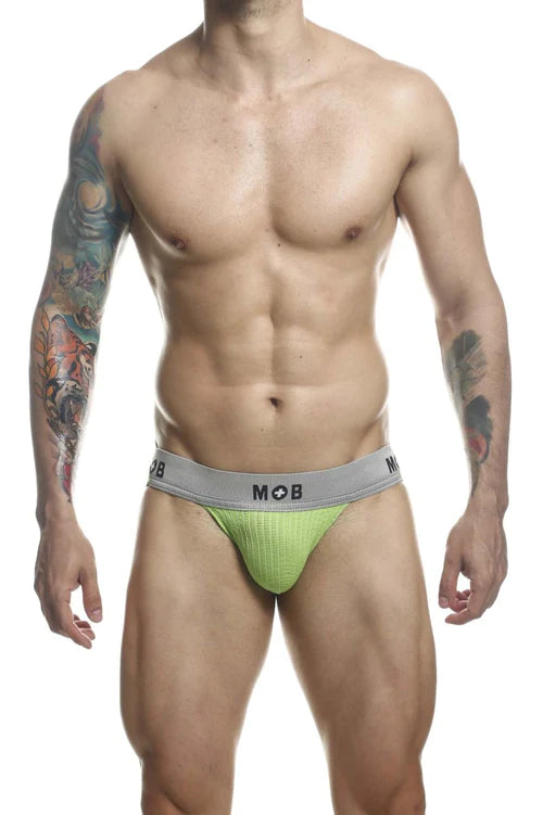 Bright lime green textured briefs with gray waistband featuring mob logo for malebasics classic fetish jockstrap in green
