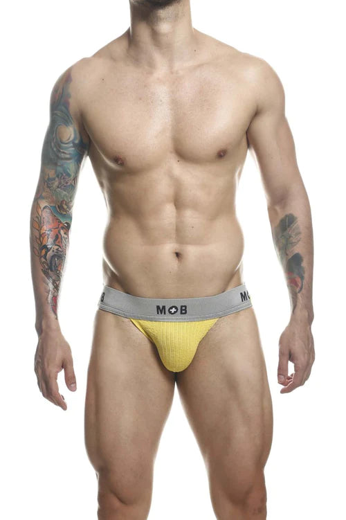 Yellow textured briefs with a gray waistband featuring the mob logo in malebasics mbl107 classic fetish jockstrap