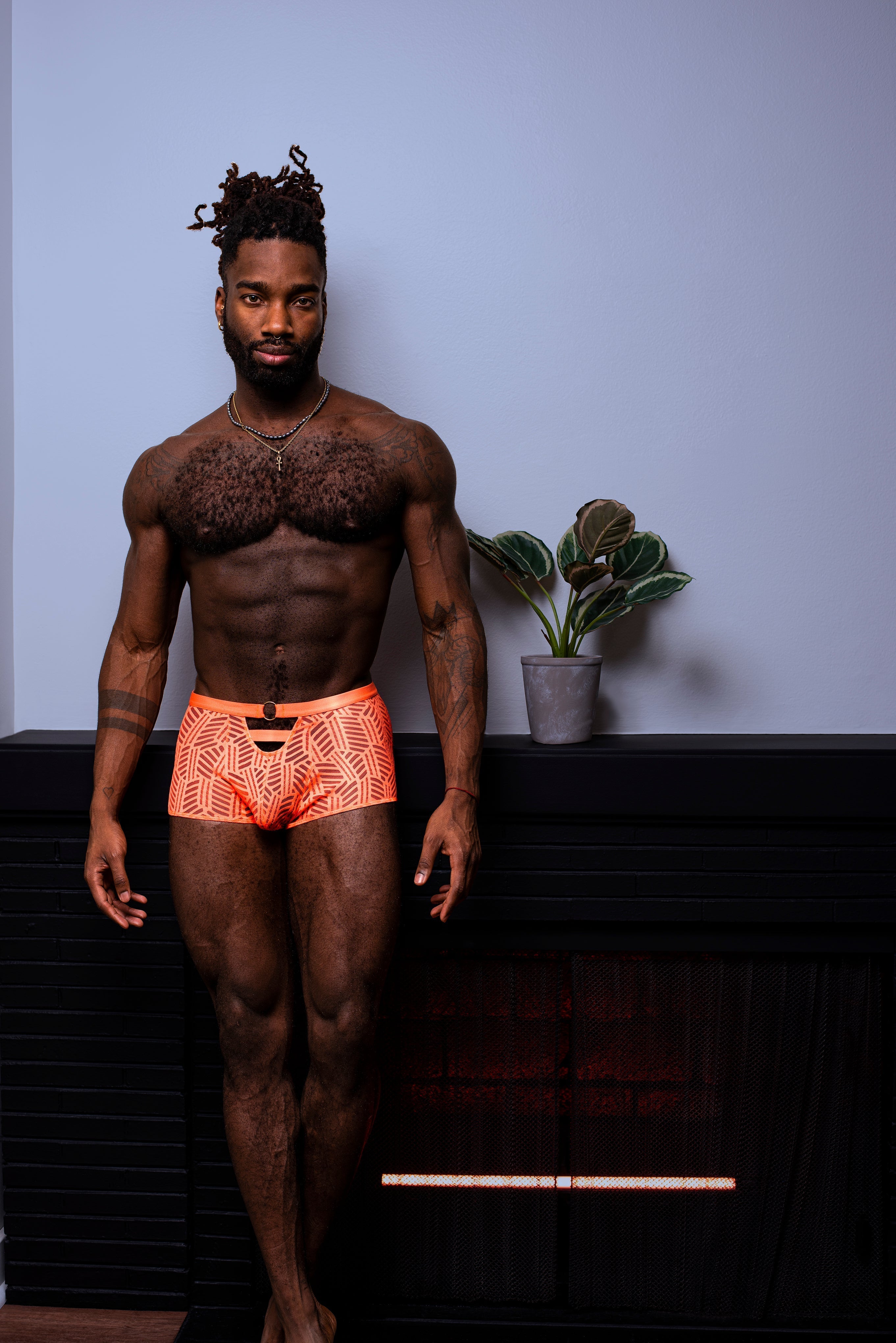 Orange patterned briefs with a geometric design showcasing the back side for versatile everyday wear