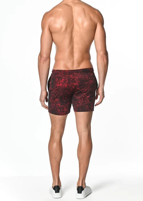 Men’s red and black patterned concrete abstract stretch performance swim trunks designed for enhanced performance.