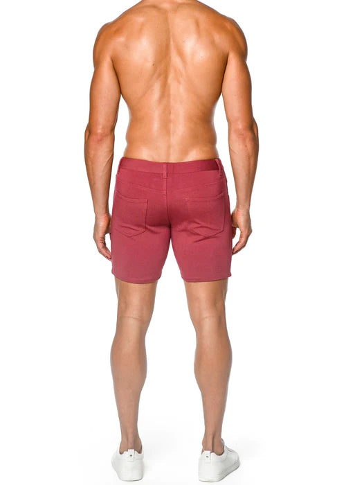 Maroon maroon tailored brick shorts with stretch knit fabric and visible back pockets showing the back side