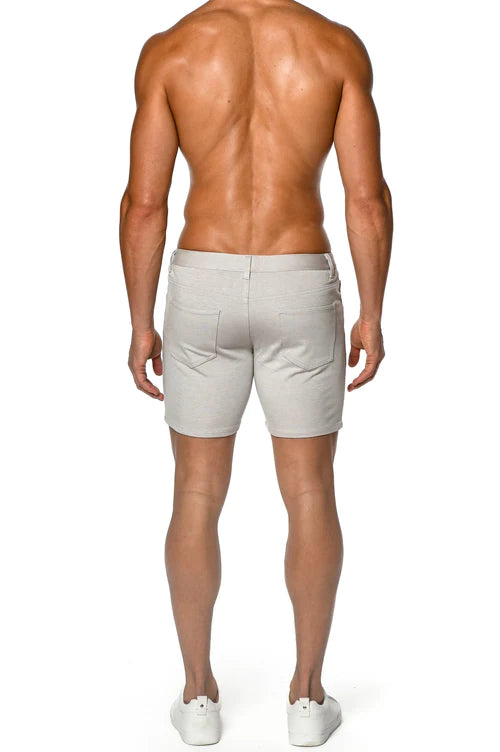 Beige st33le stretch knit shorts with a clean tailored fit and subtle stitching details in sand color
