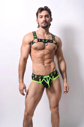 Black and neon green star-patterned men’s lingerie set with harness top and briefs featured in ssTricks Apparel 2026
