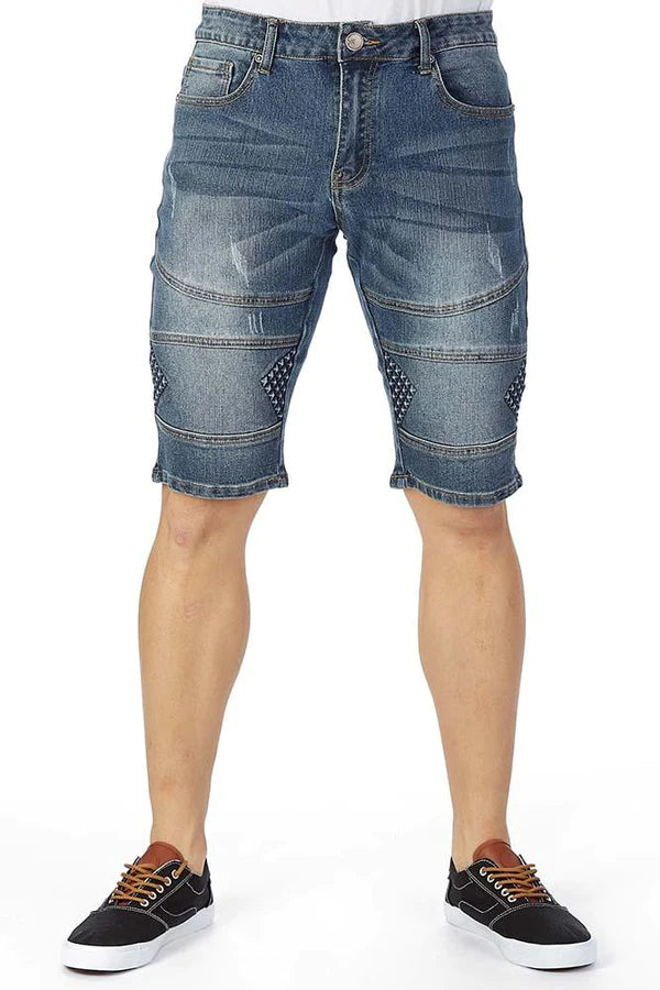 Blue denim shorts with distressed patches and diamond-patterned embossed embellishments for trendy fashion enthusiasts