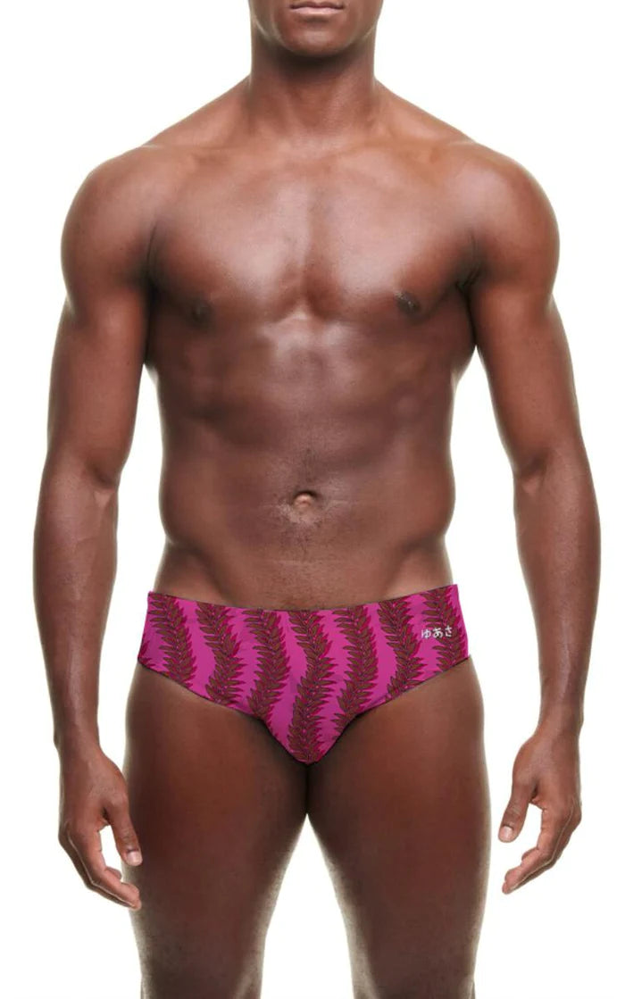 Vibrant magenta yuasa leafy vines swim brief featuring bold black feather patterns and a snug athletic cut