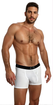 White briefs with black elastic waistband featuring wildman brand name and logo in bold rugged menswear guide