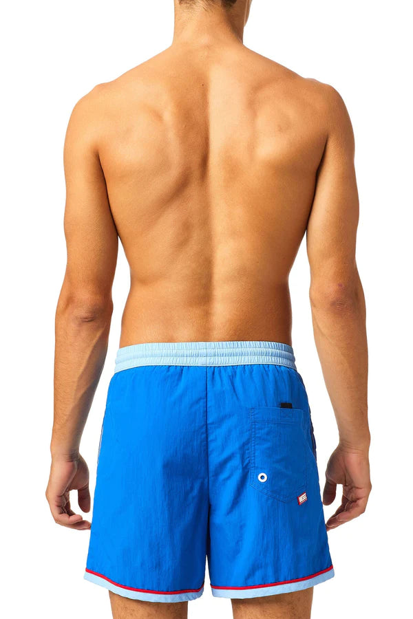 Bright blue diesel wave swim short back side with light blue elastic waistband red trim and flag logo on pocket