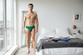 Green men’s thong underwear showing the back side made of soft breathable fabric for bold everyday wear