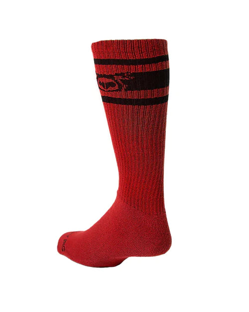 Red ribbed knee-high sock with black horizontal stripes and subtle logo by nasty pig for bold style looks