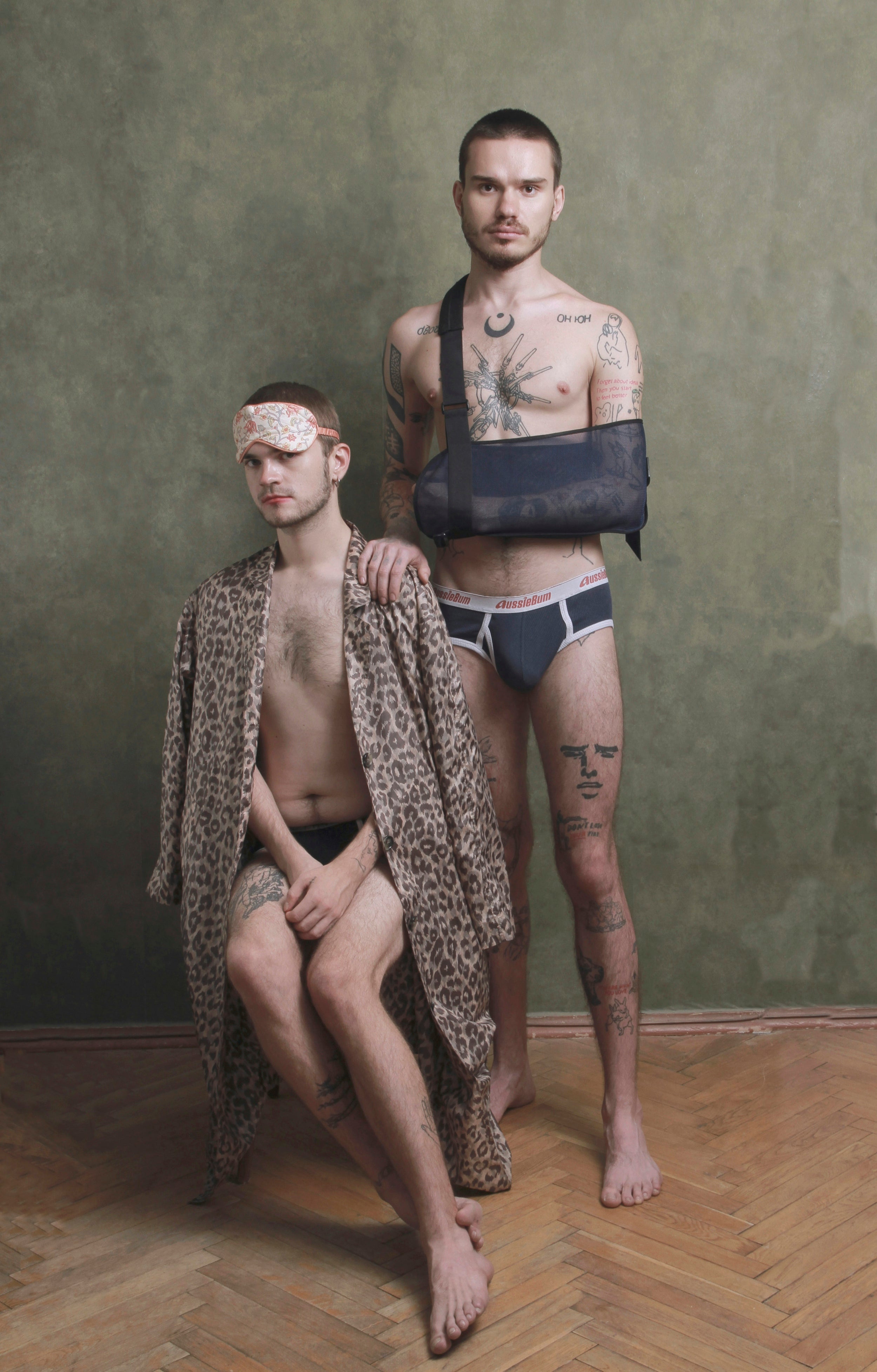 Men in stylishly masculine boxer briefs and leopard print robe, embodying ultimate comfort.