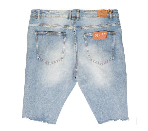 Light-wash denim shorts with frayed hem and orange brand tags from crysp denim collection