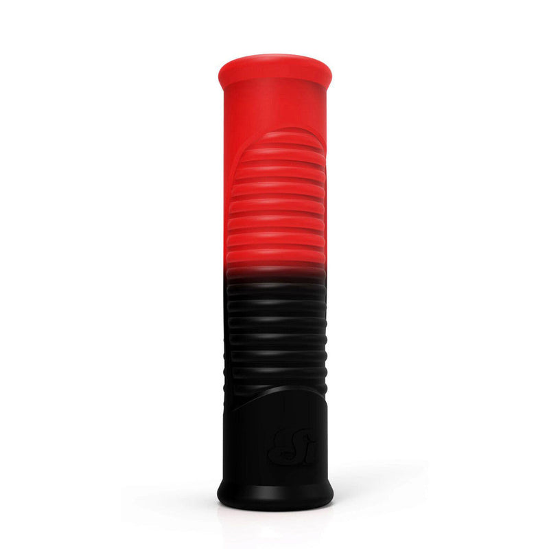 Red and black ribbed intimate accessory on a white studio background with high-contrast color blocking.
