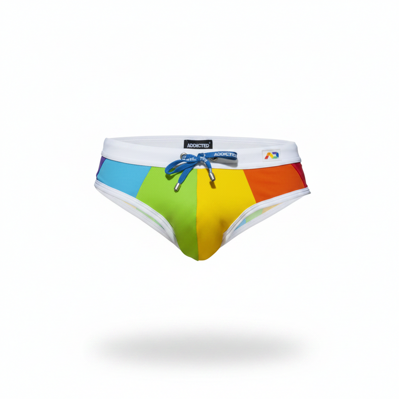 Rainbow-striped men’s swim trunks in vibrant blue green yellow and red with white waistband and blue drawstring from Addicted Underwear
