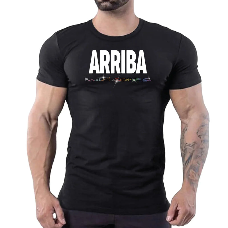 Black fitted mens T-shirt with bold ARRIBA lettering and colorful linear accent against a neutral backdrop
