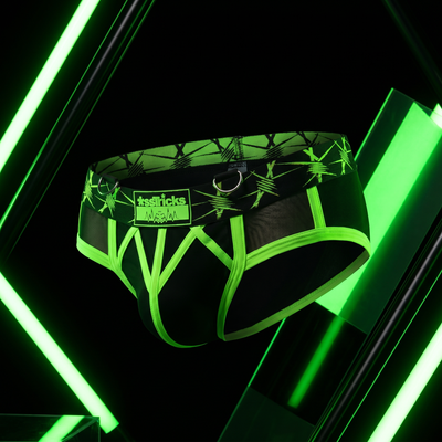 Bold neon circuit-party editorial for *ssTricks Apparel collection featuring electric green and black tones with dramatic strobe lighting