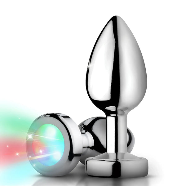 Jeweled crystal anal plug set with smooth tapered silicone bodies, displayed against a white background.