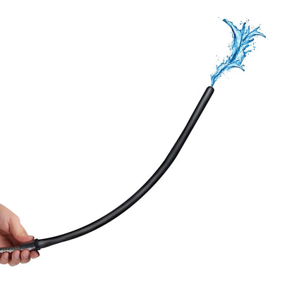 A hand holds a black tube spraying water against a white background.