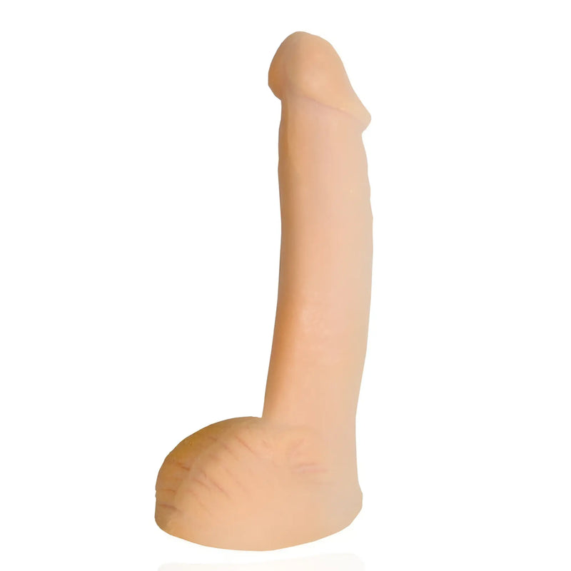 A smooth, beige, phallus-shaped silicone object stands against a plain white background.