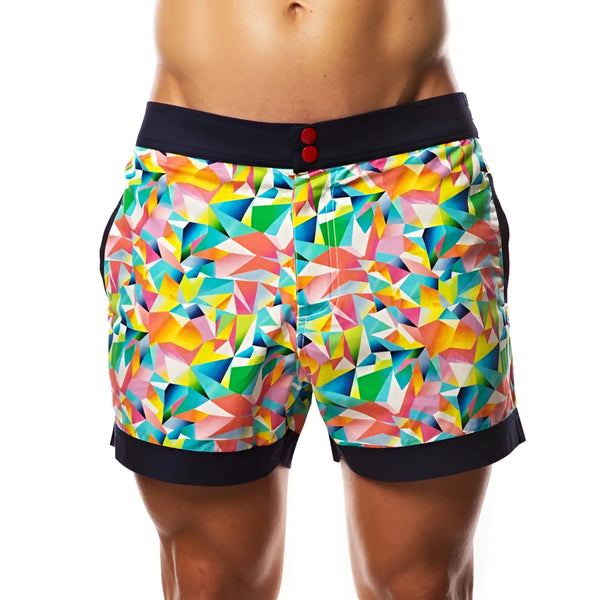 Colorful geometric pattern swim shorts with black waistband against white background.