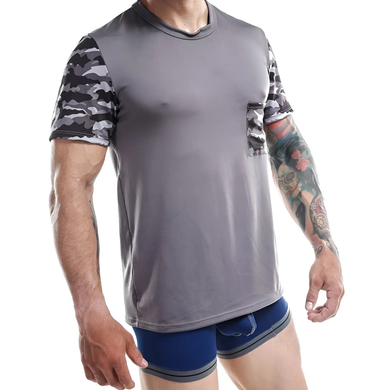 Grey shirt with camouflage sleeves and pocket on a white background backdrop.