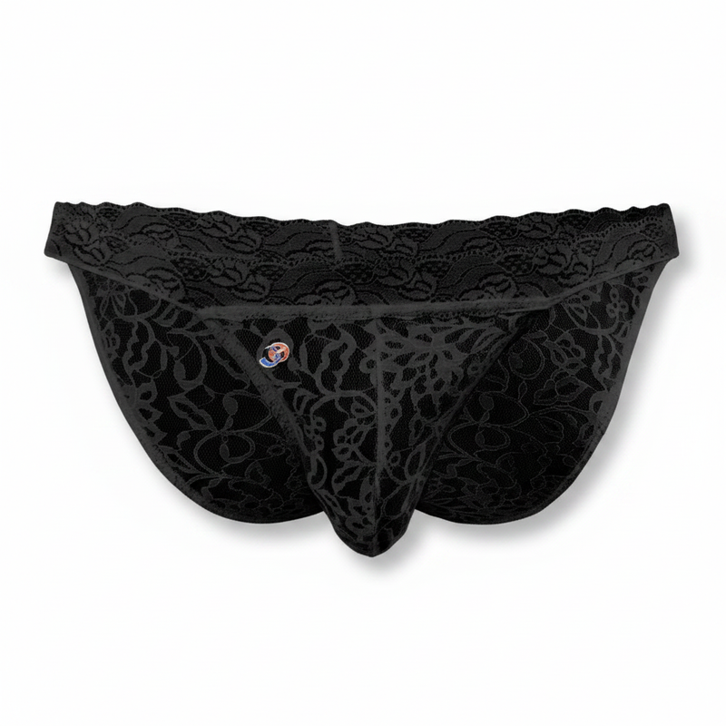 Black lace thong with intricate floral patterns and small circular logo front in Joe Snyder Underwear collection