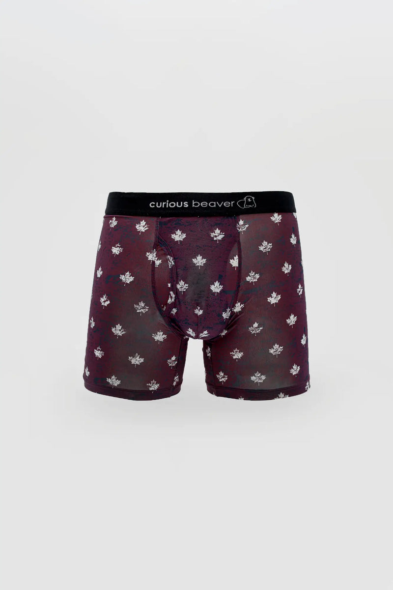 Burgundy boxer briefs with white maple leaf print and black elastic waistband.