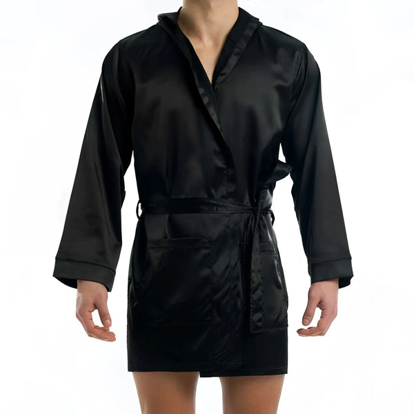 A person wears a black satin robe tied at the waist, white background.