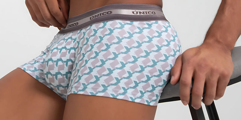 Unico men’s boxer briefs with white base and teal pink geometric pattern gray waistband from gay men’s pride collection