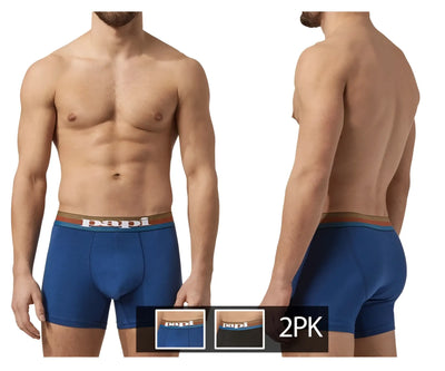 Man wearing blue cotton boxer briefs with striped waistband against white background.