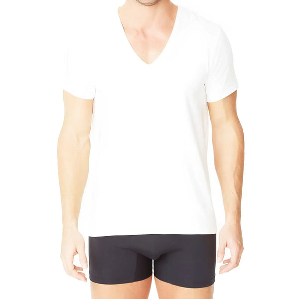 Man wears white cotton V-neck t-shirt and black boxer briefs, isolated white.