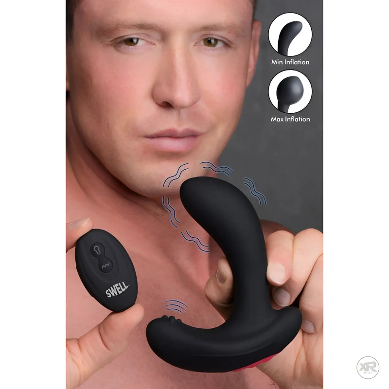A man holds a black curved silicone device and a small controller.
