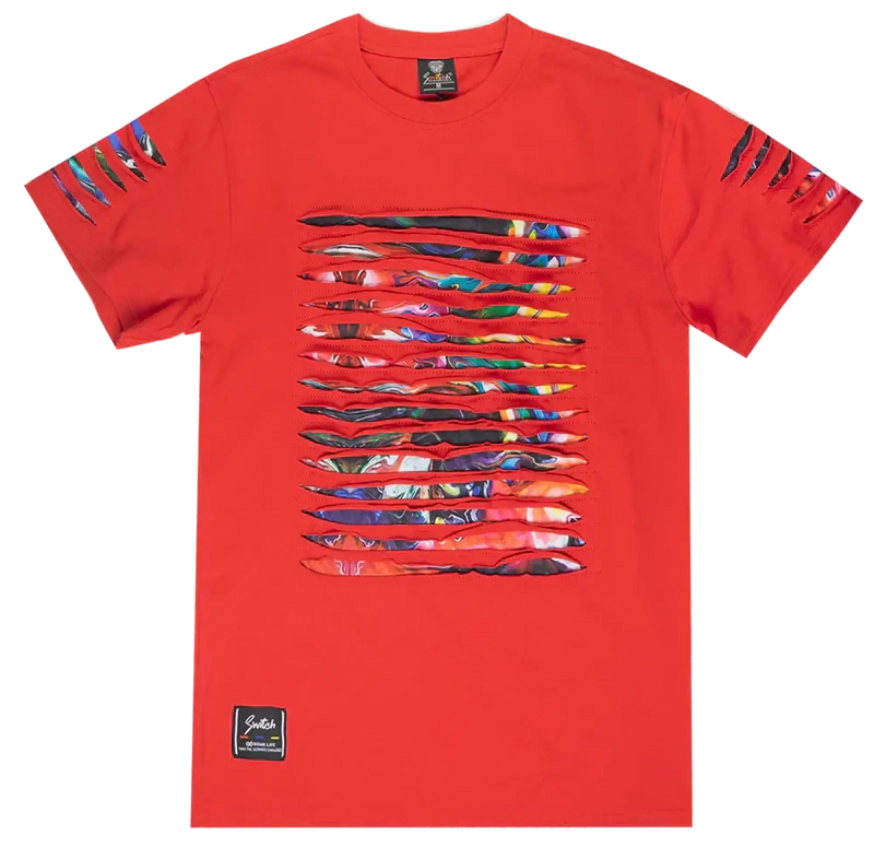 Red t-shirt with horizontal slashed fabric revealing colorful abstract patterns against black.