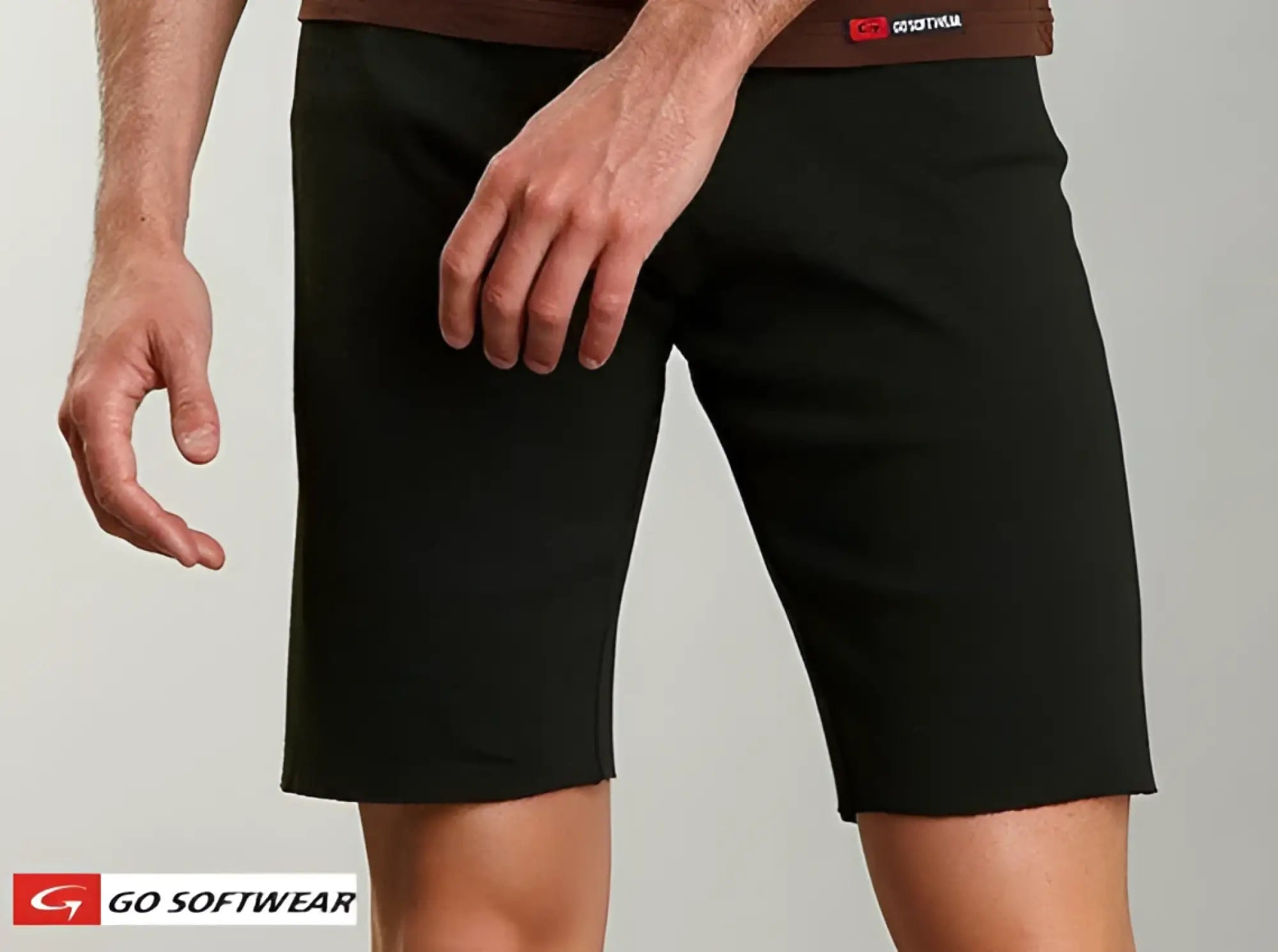 16 inch cut-off black cotton shorts with a brown waistband featuring the go softwear logo