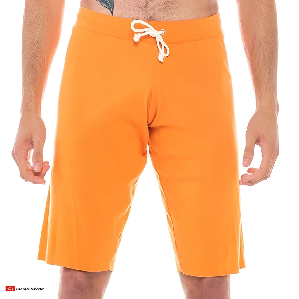 Bright orange 16 cut-off athletic shorts with white drawstring waistband designed for active wear