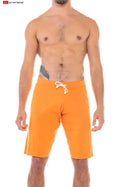 Bright orange 16 cut-off shorts with white drawstring waistband perfect for casual summer wear