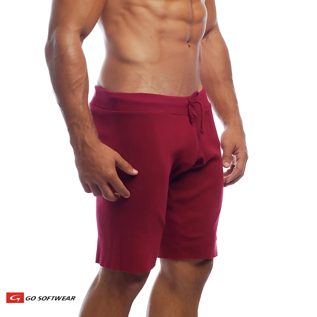 Red 16 inch cut-off athletic shorts with drawstring waistband made from breathable material for active wear