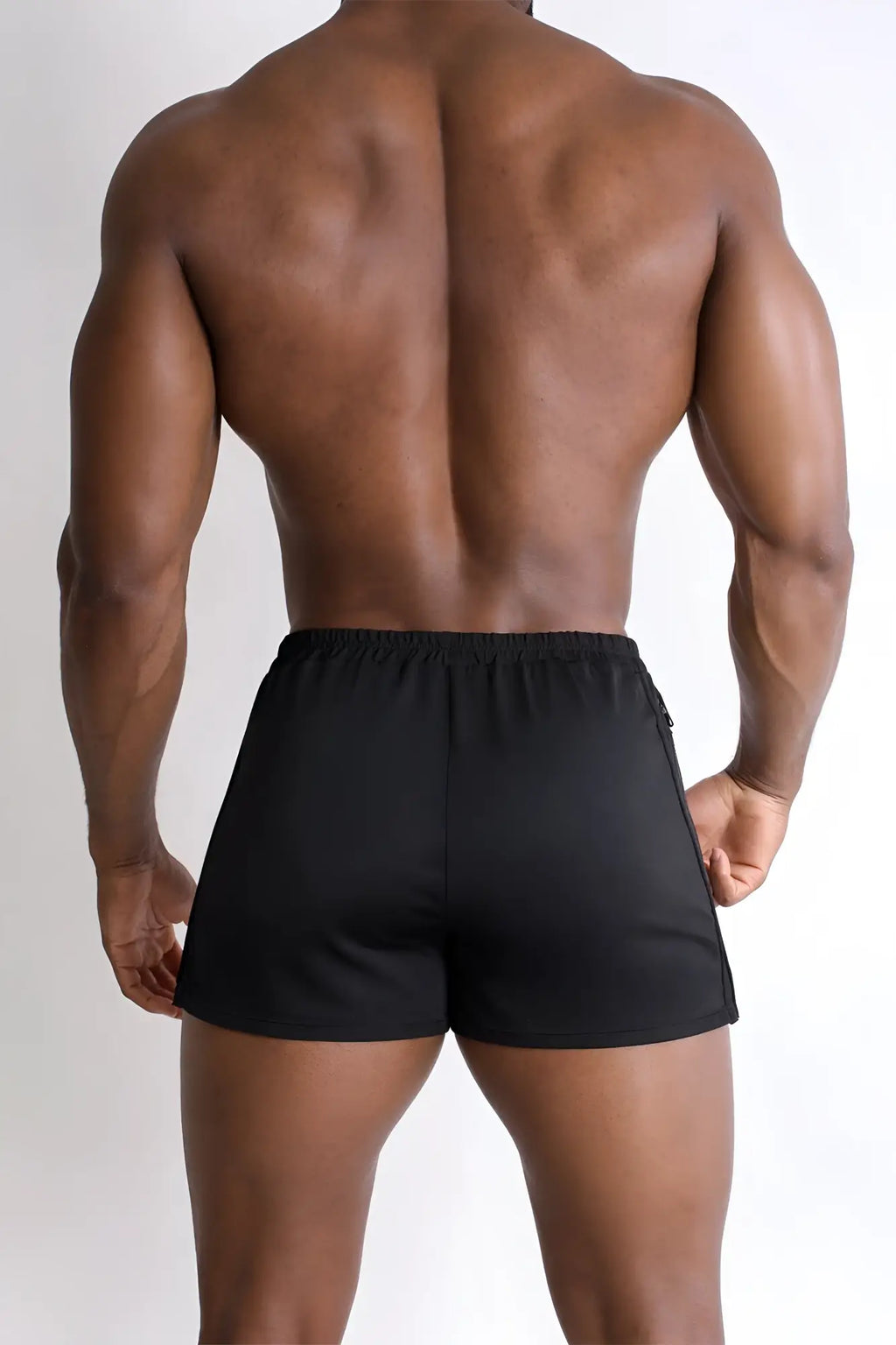 Black 2 inch side split booty shorts with sleek form fitting design and subtle side seam detailing in midnight black