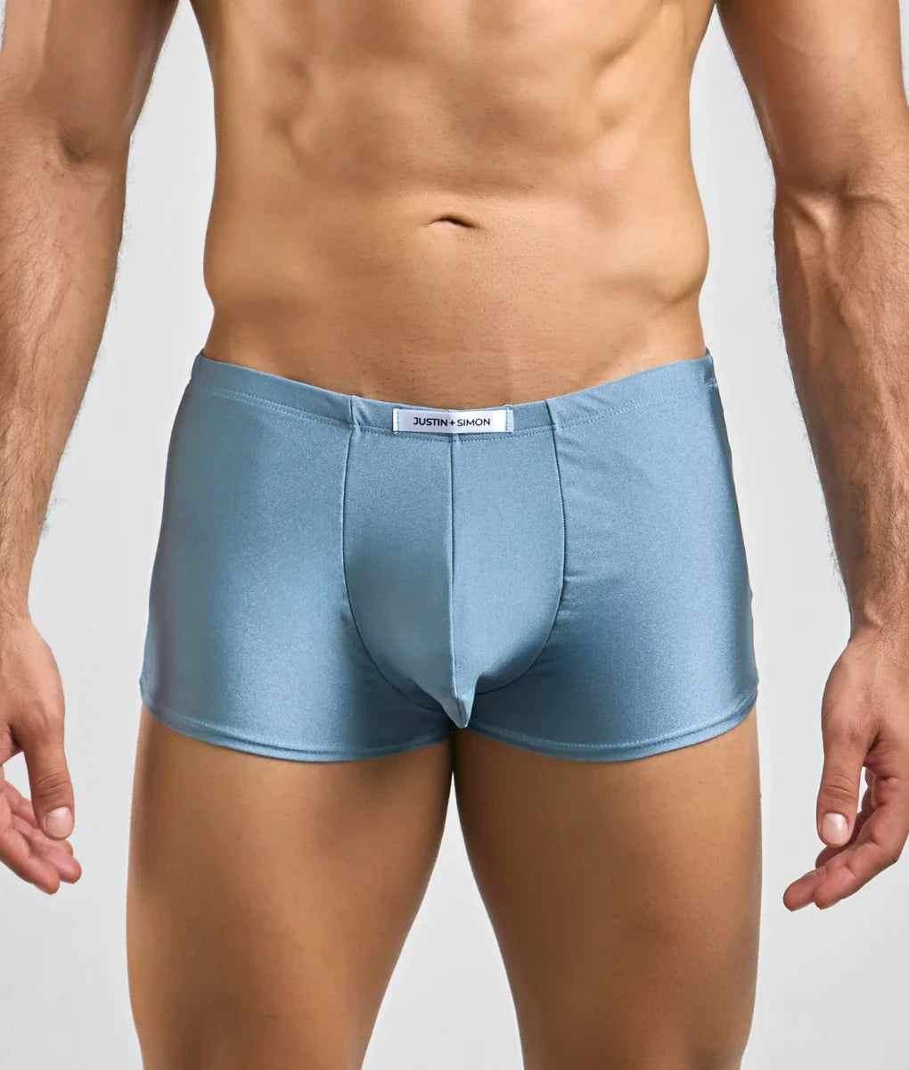 Light blue shiny satin briefs with white brand tag at waistband from Justin and Simon classic boxer collection