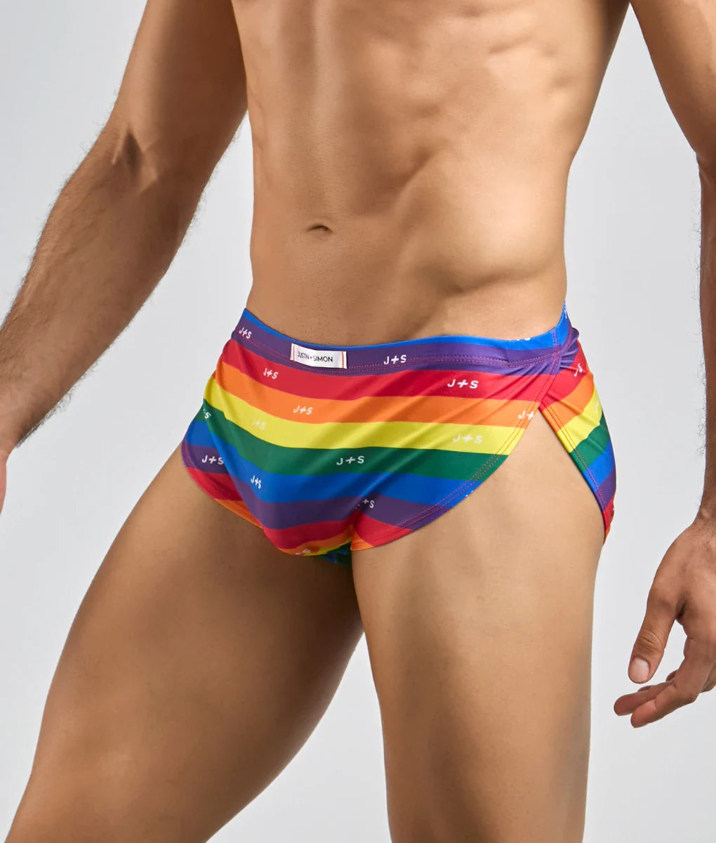 Justin and simon running short swim trunks with rainbow stripes and repeating brand logo in vibrant colors