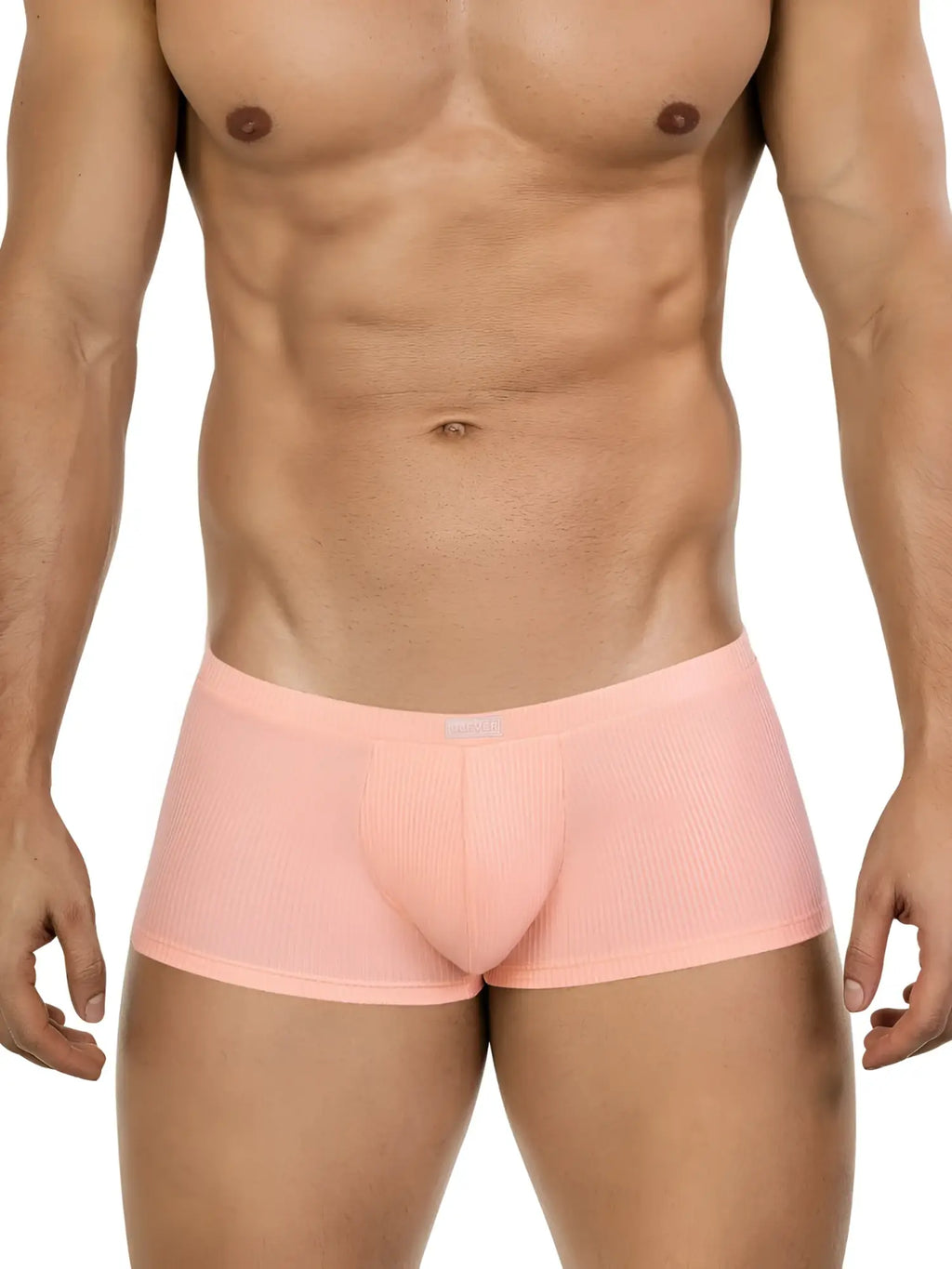 A man wears 26014 Apolo trunks in a light orange, ribbed fabric with a clean, low-rise style.