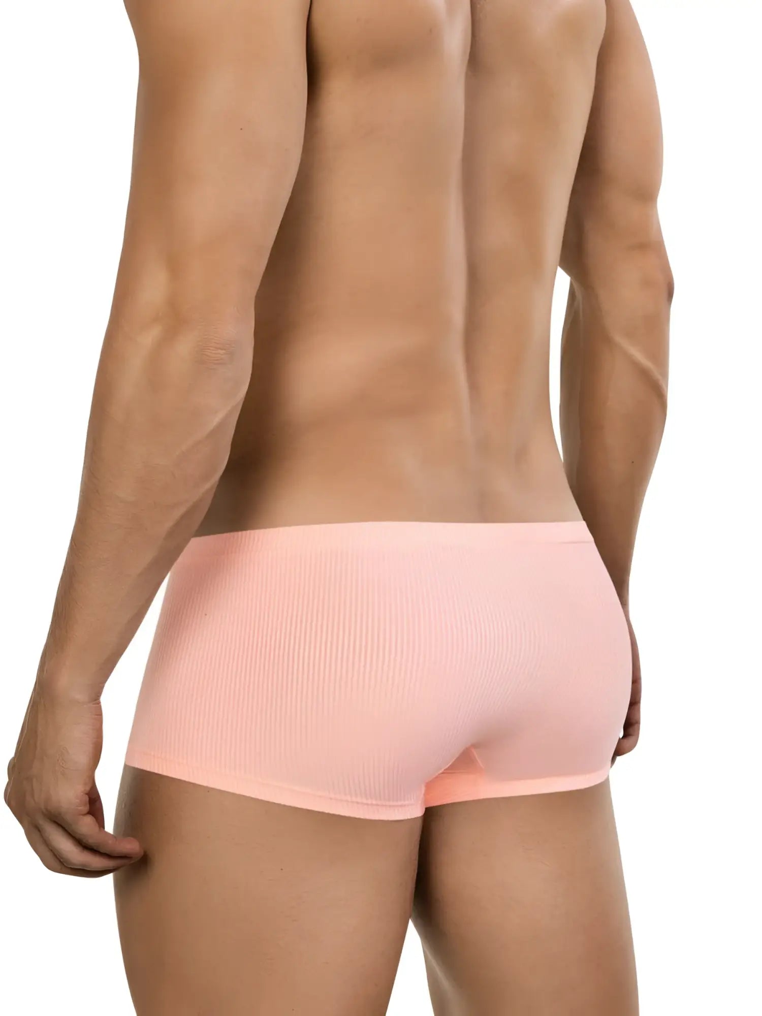 Rear view of a man wearing ribbed, orange 26014 Apolo trunks against a white background.