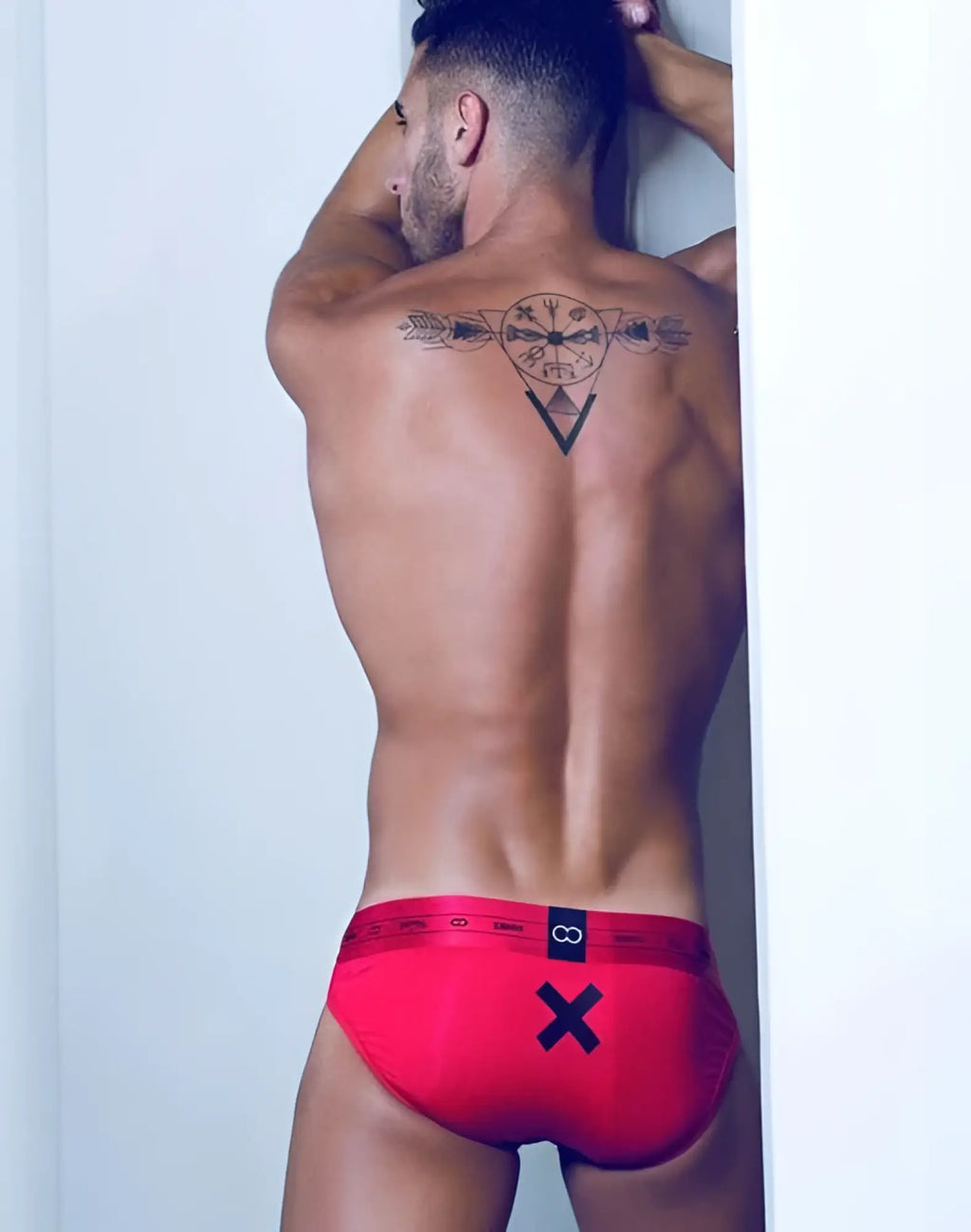 Red men’s briefs 2EROS X Series with black x and infinity symbol logo on waistband size L passion underwear