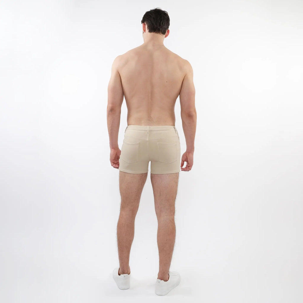 Beige 3 inch stretch knit athletic briefs with sleek minimalist design and subtle stitching details