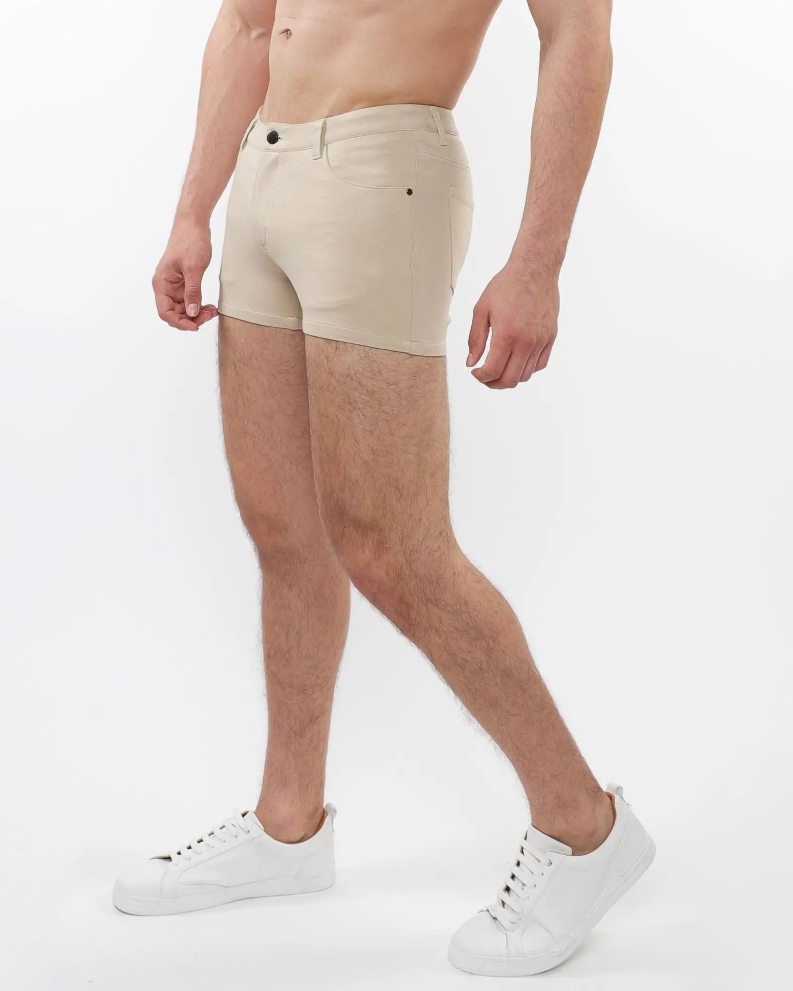 Beige 3 inch stretch knit chino shorts with classic five pocket design and black button closure